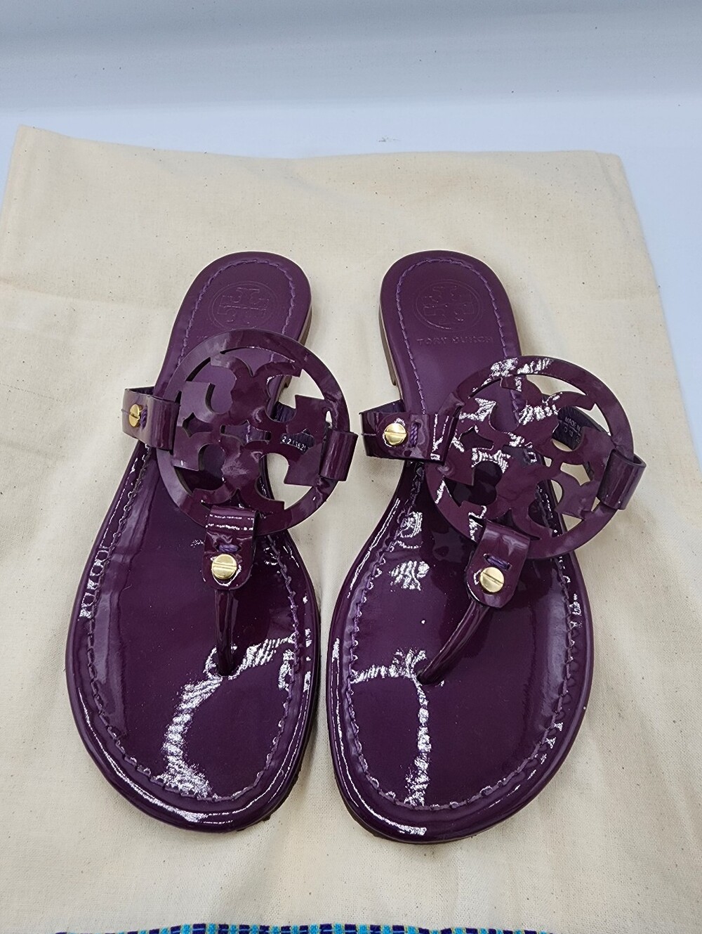 Tory Burch Patent Logo Thong Sandals in Plum